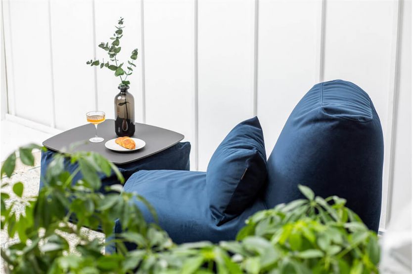A pouf with a metal tabletop